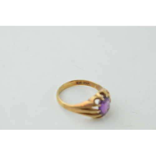 339 - A gentleman's ring set with purple stone. Ring size Q. Gross weight 3.8 grams.