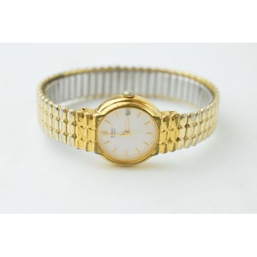 345 - A lady's gilt metal Seiko watch with white dial, baton numerals and expanding bracelet.