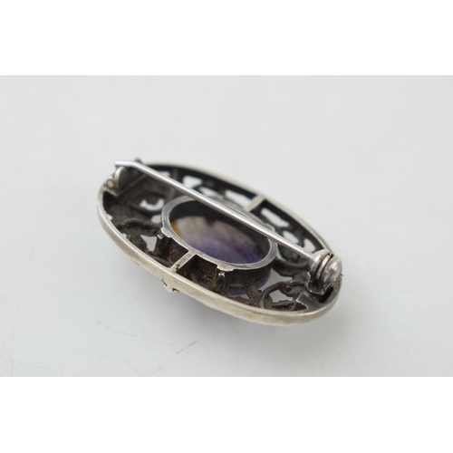 369 - Sterling silver brooch, Arts and Crafts style, set with Blue John insert, 36mm wide.