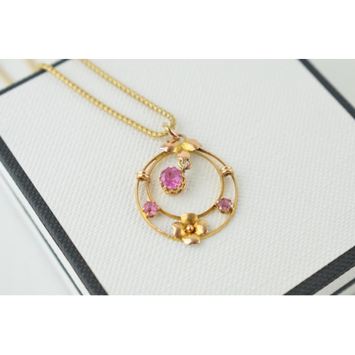 373 - A 9ct yellow gold pendant on chain marked .375. Drop pendant with flower design in Alfred Peters, Wi... 