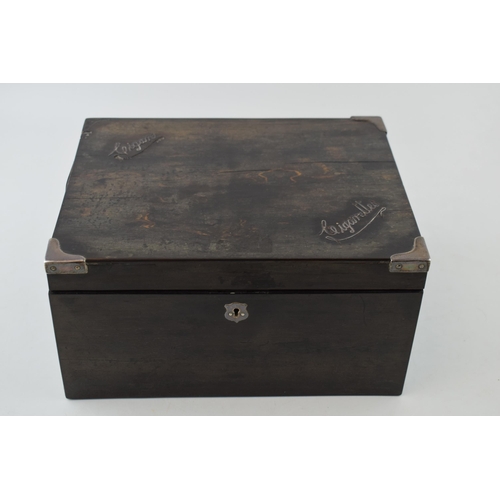 394 - An antique coramandel wooden cigarette and cigar box, silver plated mounts, 26x21x13cm tall.