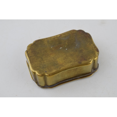 396 - A pair of vintage snuff boxes to include a brass engraved example 'take a pinch and welcome' with an... 