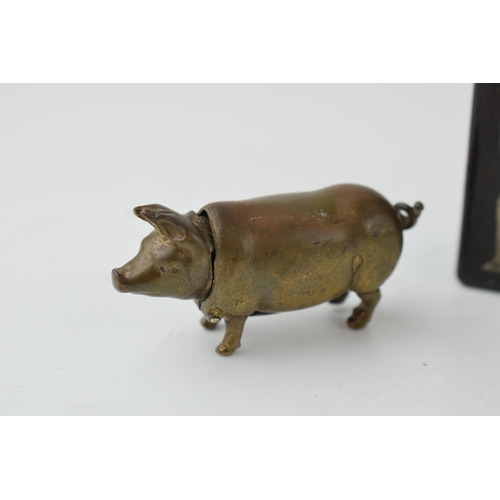 397 - A brass novelty vesta case in the form of a pig, with a decorated matchbox holder (2).