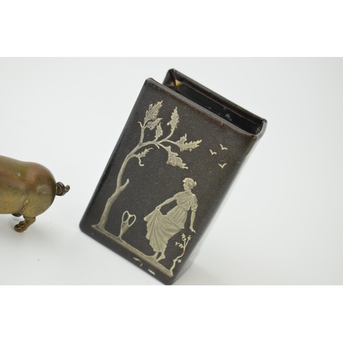 397 - A brass novelty vesta case in the form of a pig, with a decorated matchbox holder (2).