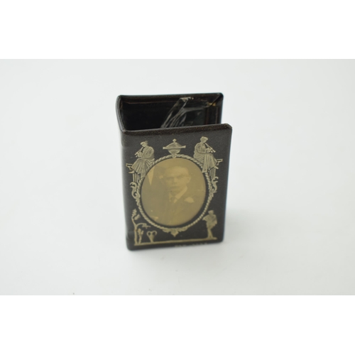 397 - A brass novelty vesta case in the form of a pig, with a decorated matchbox holder (2).