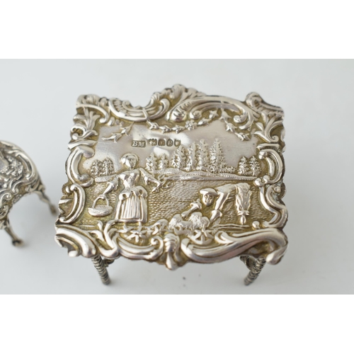 403 - Victorian embossed silver miniature table Birmingham 1896 with associated chair, 27.6 grams (2).