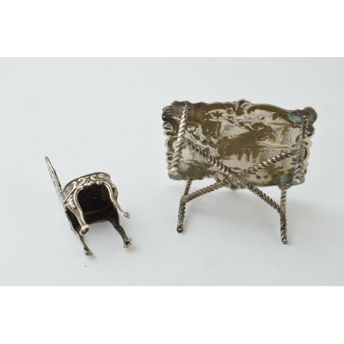 403 - Victorian embossed silver miniature table Birmingham 1896 with associated chair, 27.6 grams (2).