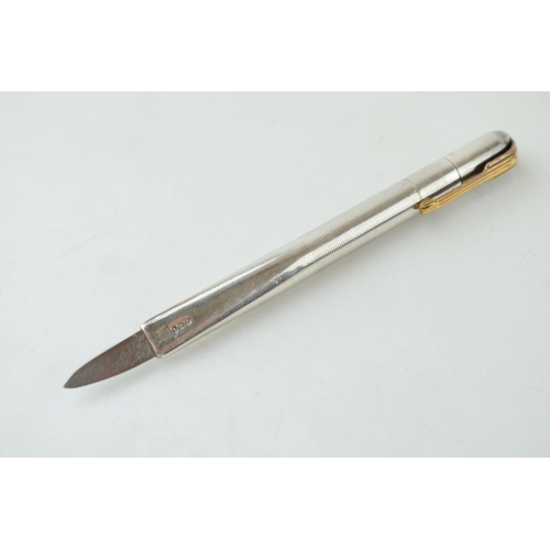 405 - Sterling silver retractable letter opener in the form of a pen, 12cm long, working action.