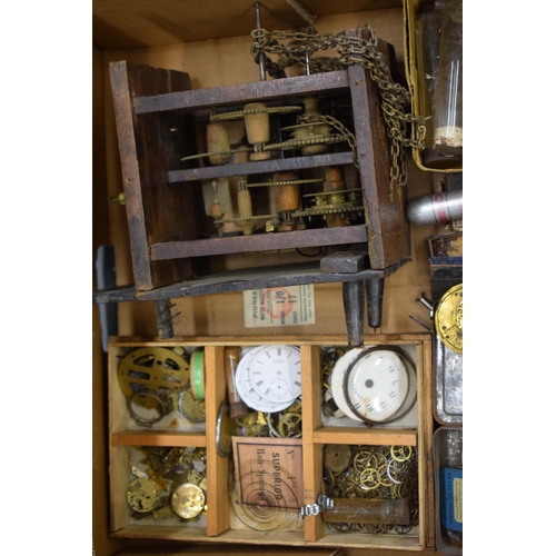 413 - A mixed collection of clock and watch spare parts to include movements, clock key, tools and various... 