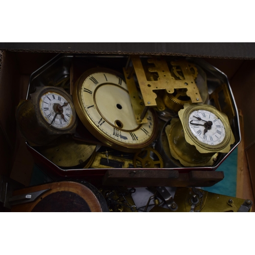 414 - A mixed collection of clock spare parts to include movements, chimes, cases and various similar item... 