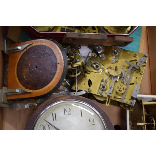 414 - A mixed collection of clock spare parts to include movements, chimes, cases and various similar item... 