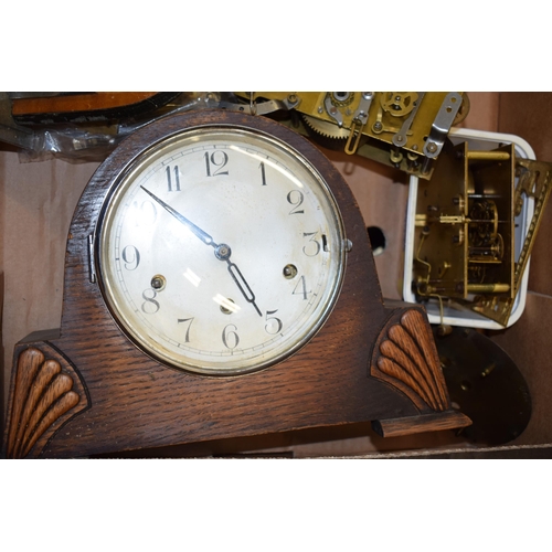 414 - A mixed collection of clock spare parts to include movements, chimes, cases and various similar item... 