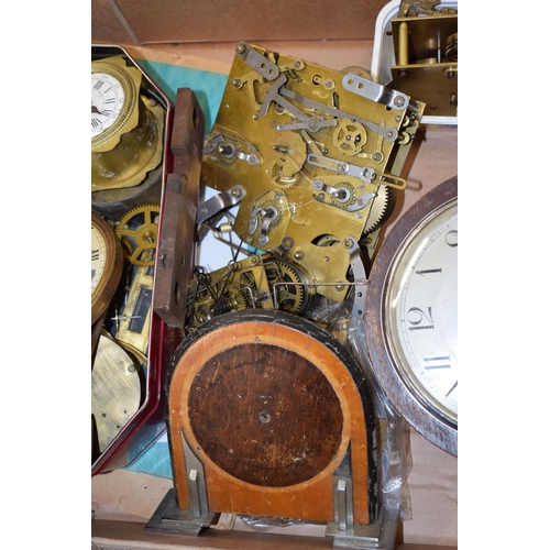 414 - A mixed collection of clock spare parts to include movements, chimes, cases and various similar item... 