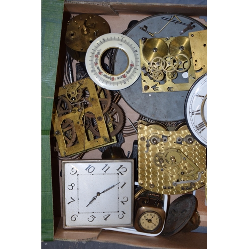 415 - A mixed collection of clock spare parts to include movements, chimes, cases and various similar item... 