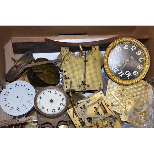 416 - A mixed collection of clock spare parts to include movements, chimes, cases and various similar item... 