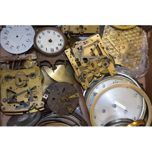 416 - A mixed collection of clock spare parts to include movements, chimes, cases and various similar item... 