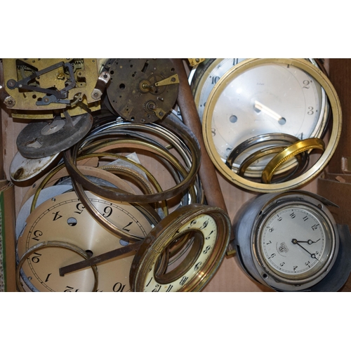 416 - A mixed collection of clock spare parts to include movements, chimes, cases and various similar item... 