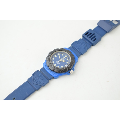 431 - A Tag Heuer Professional Quartz wristwatch. Blue circular dial with luminous hands and luminous hour... 