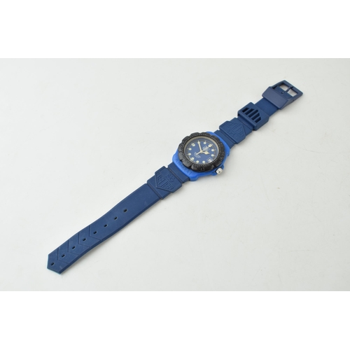 431 - A Tag Heuer Professional Quartz wristwatch. Blue circular dial with luminous hands and luminous hour... 