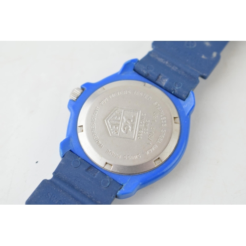 431 - A Tag Heuer Professional Quartz wristwatch. Blue circular dial with luminous hands and luminous hour... 