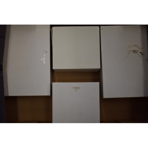 446 - A collection of original Omega outer white boxes. (9)