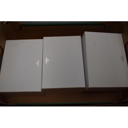 446 - A collection of original Omega outer white boxes. (9)