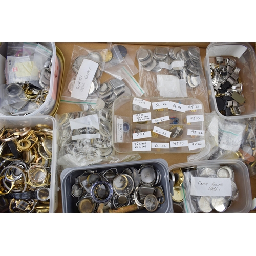 447 - A large collection of watch parts to include bezels, quartz movements, watch backs and links.