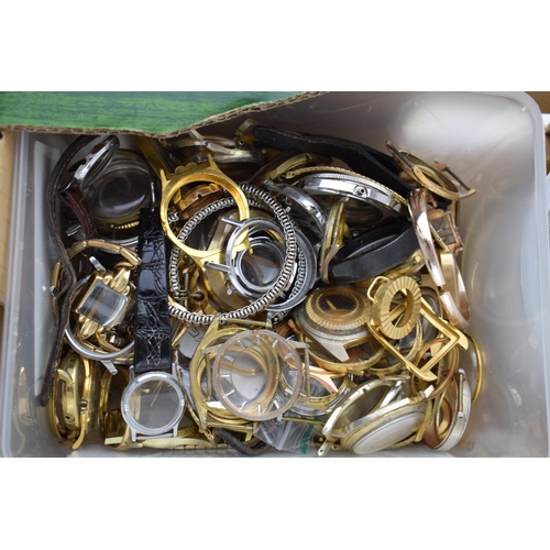 447 - A large collection of watch parts to include bezels, quartz movements, watch backs and links.