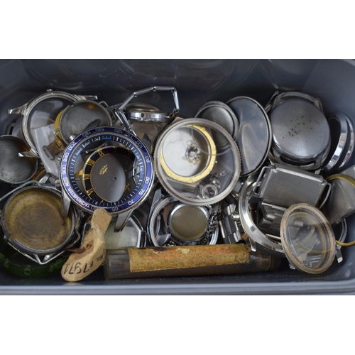 447 - A large collection of watch parts to include bezels, quartz movements, watch backs and links.