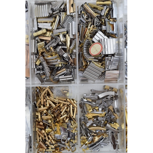 451 - A collection of watch spare parts to include T bars, links, pins, buckles and other similar items. (... 