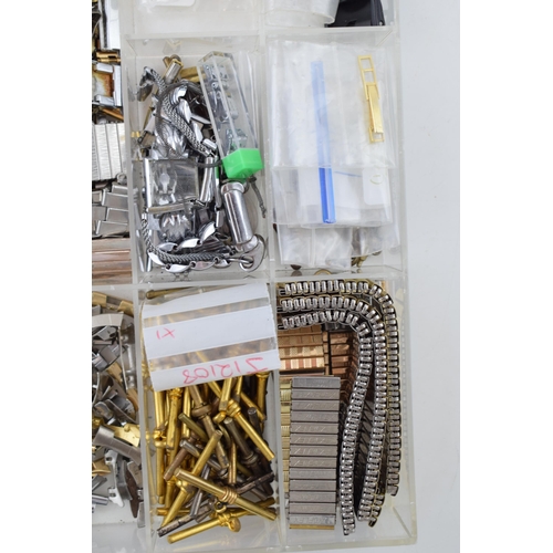 451 - A collection of watch spare parts to include T bars, links, pins, buckles and other similar items. (... 