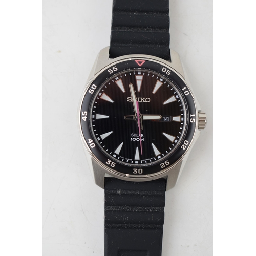 459 - A Seiko Solar 100M Divers watch on rubber strap. Black circular dial with date window at 3 o'clock. ... 