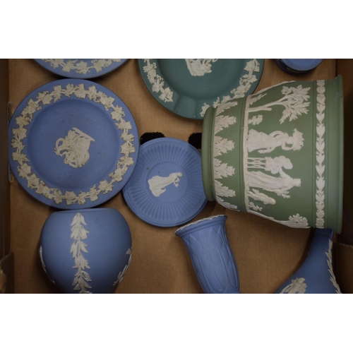 537 - A collection of Wedgwood Jasperware to include vases, bud vases, lidded pots, trinket trays and pin ... 