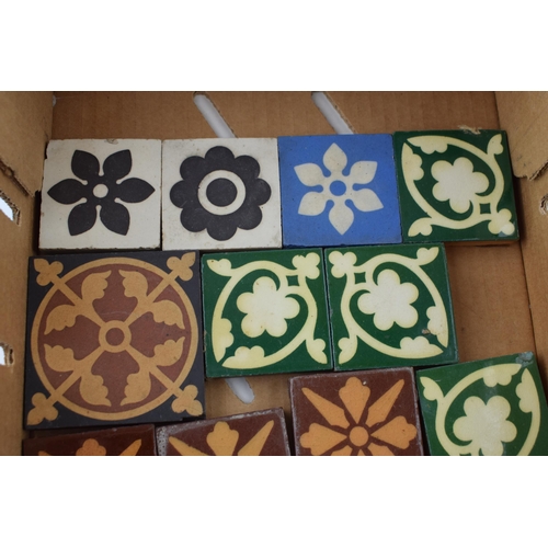 574 - A collection of encaustic tiles by manufactures Minton Hollins, Craven Dunhill & Co and The Campbell... 