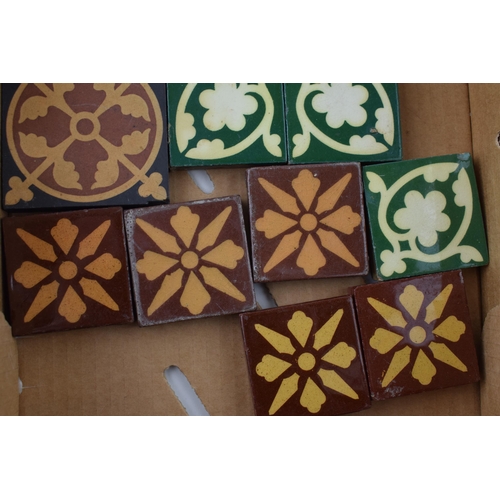 574 - A collection of encaustic tiles by manufactures Minton Hollins, Craven Dunhill & Co and The Campbell... 