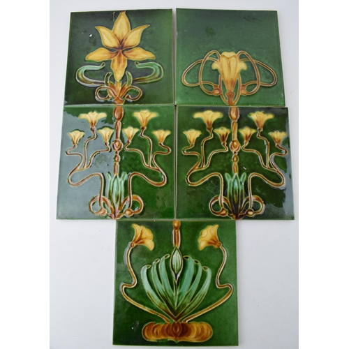 576 - Five Victorian Art Nouveaux tiles with green ground. (5)