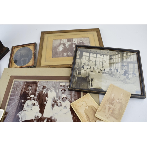 619 - A mixed collection of items to include antique photographs, antique photo frames, a desk pencil shar... 