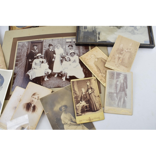 619 - A mixed collection of items to include antique photographs, antique photo frames, a desk pencil shar... 