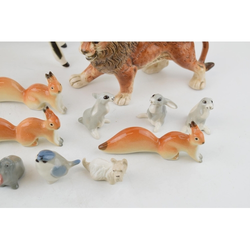 112 - A collection of Russian USSR / Lomonsov pottery animals to include an unusual lare calf, stylised fo... 