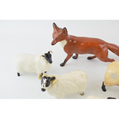 194 - Beswick to include a large standing fox, 2 ewes, a ram and a lamb with a later John Beswick sheep (Q... 