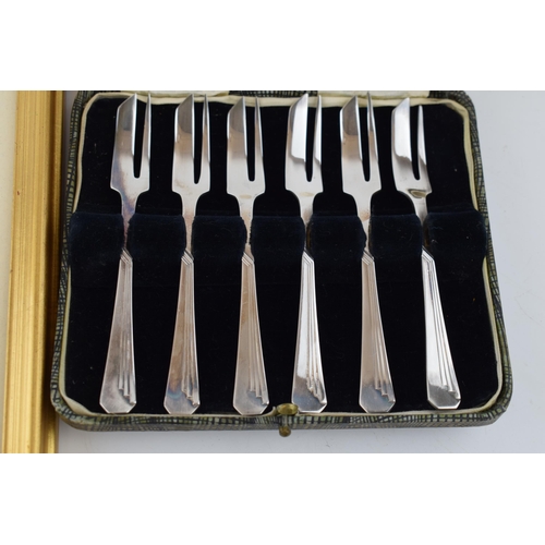 380A - A cased set of 6 silver plated cake forks by Dixon, with a Russell Flint print of a coastal scene (2... 