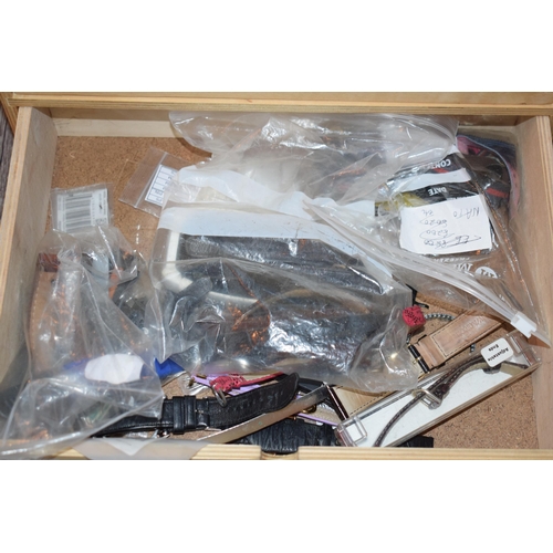 479 - Two sets of drawers containing watch and lock parts to include NOS watch straps and bracelets, ceram... 