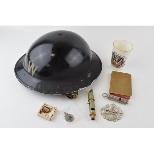 495 - A collection of items to include an A.R.P Wardens helmet together with an A.R.P whistle together wit... 