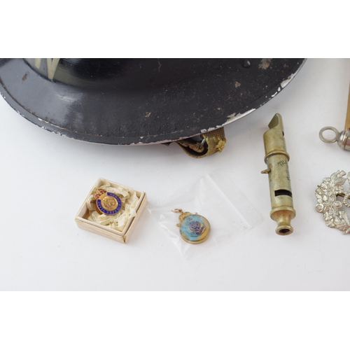 495 - A collection of items to include an A.R.P Wardens helmet together with an A.R.P whistle together wit... 