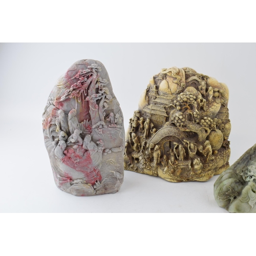 542 - A collection of oriental stone effect carvings, largest 25Cm tall.