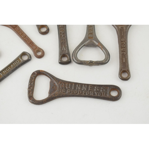 544 - A collection of antique cast iron advertising bottle openers for brands, 'Guiness', 'W.Y. & Co. Ltd,... 