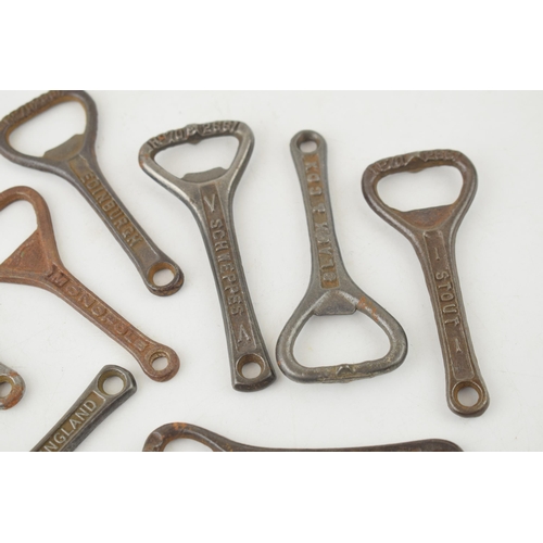 544 - A collection of antique cast iron advertising bottle openers for brands, 'Guiness', 'W.Y. & Co. Ltd,... 