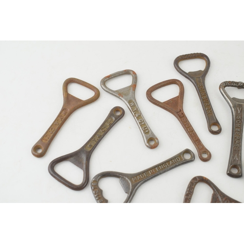 544 - A collection of antique cast iron advertising bottle openers for brands, 'Guiness', 'W.Y. & Co. Ltd,... 