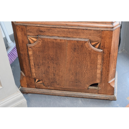 546 - An early 19th century oak and mahogany longcase clock with swan pediment, named 'H Loat of Wrexham',... 