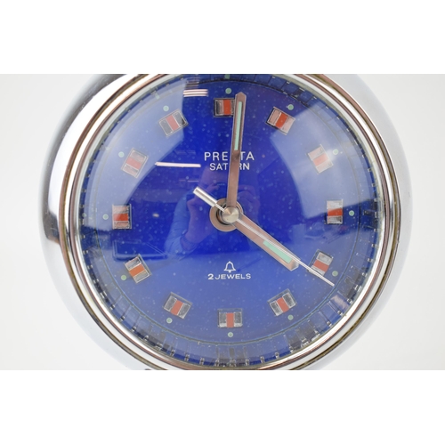 548 - A Presta Saturn 2 jewels Chrome vintage clock c1970s. Round blue metalic dial with orange applied ba... 